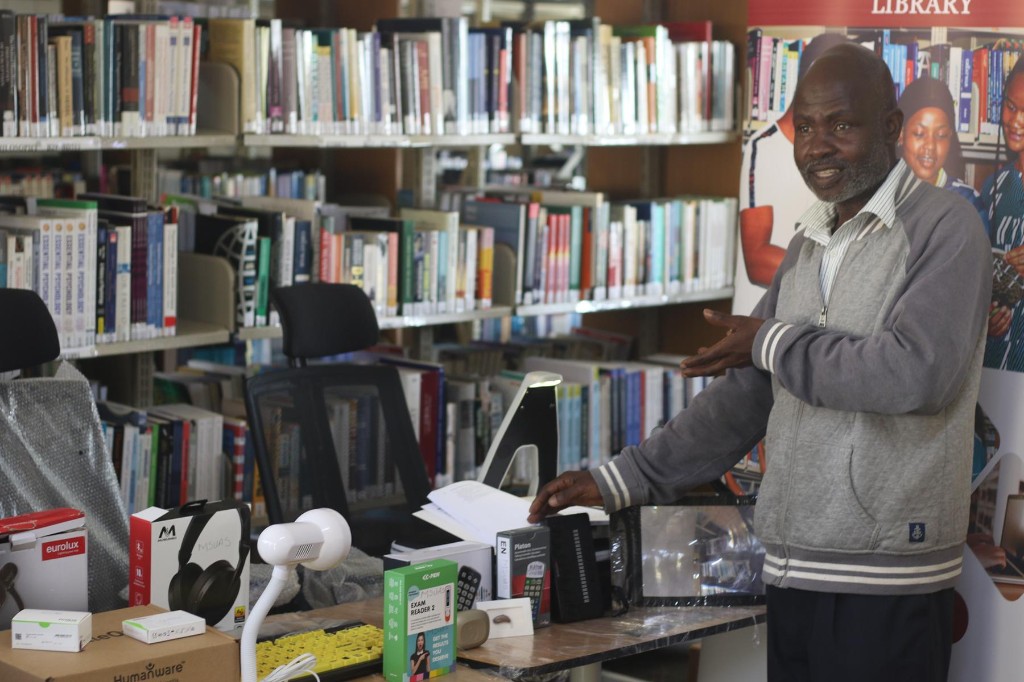 Library staff presenting newly received assistive technology devices